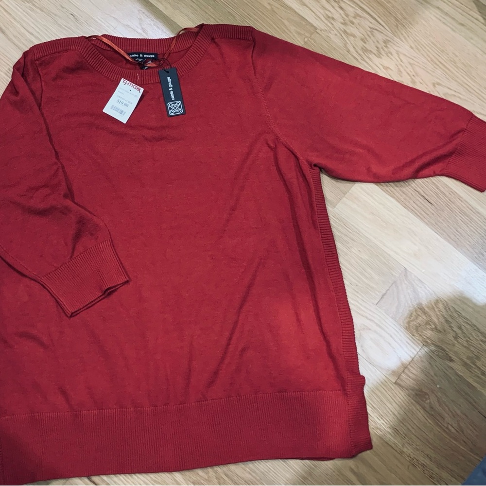 Crew neck 3/4 sleeve sweater. New with tags, never worn. Rusty red in color 2x